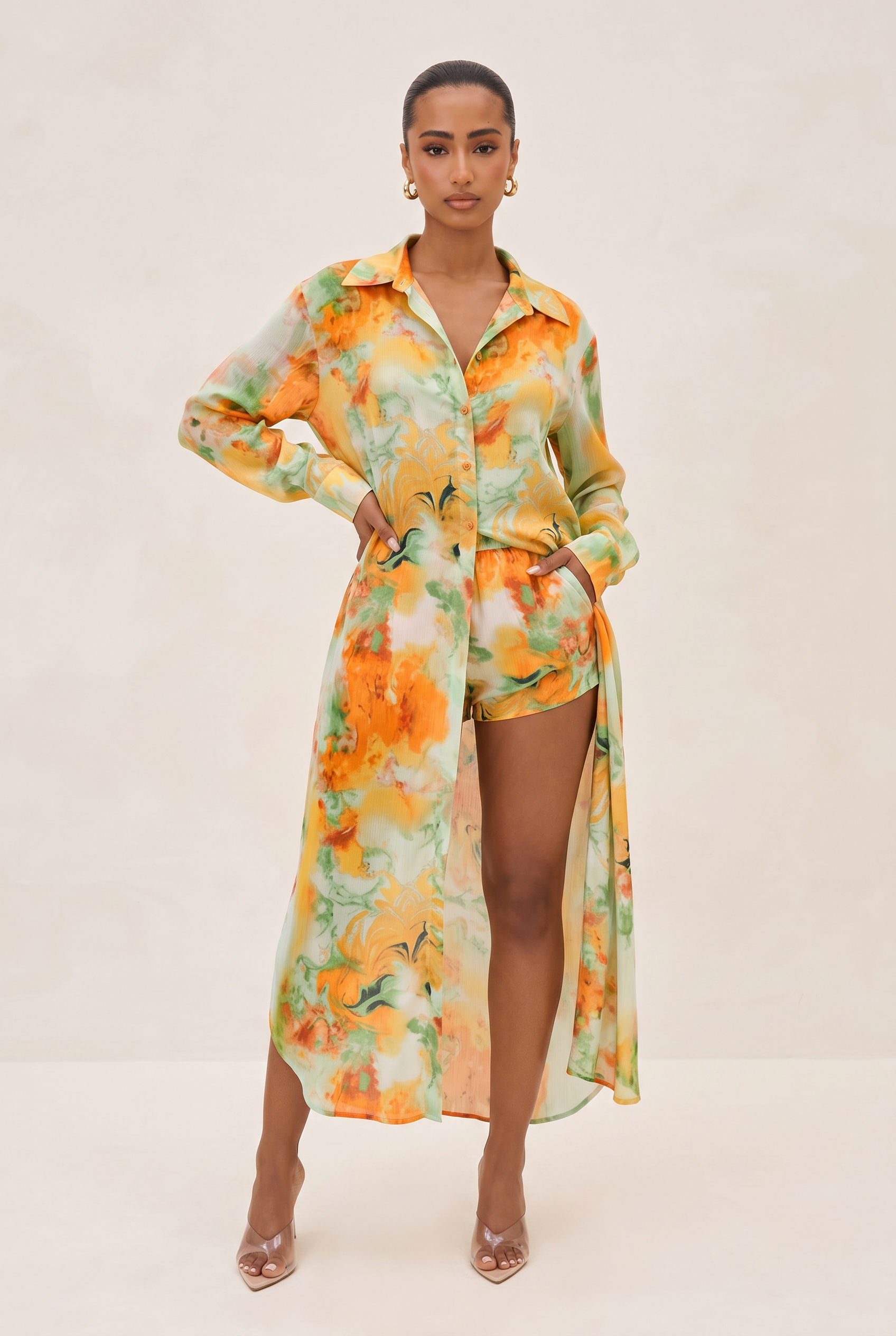 Woman wearing a floral dress with a white background