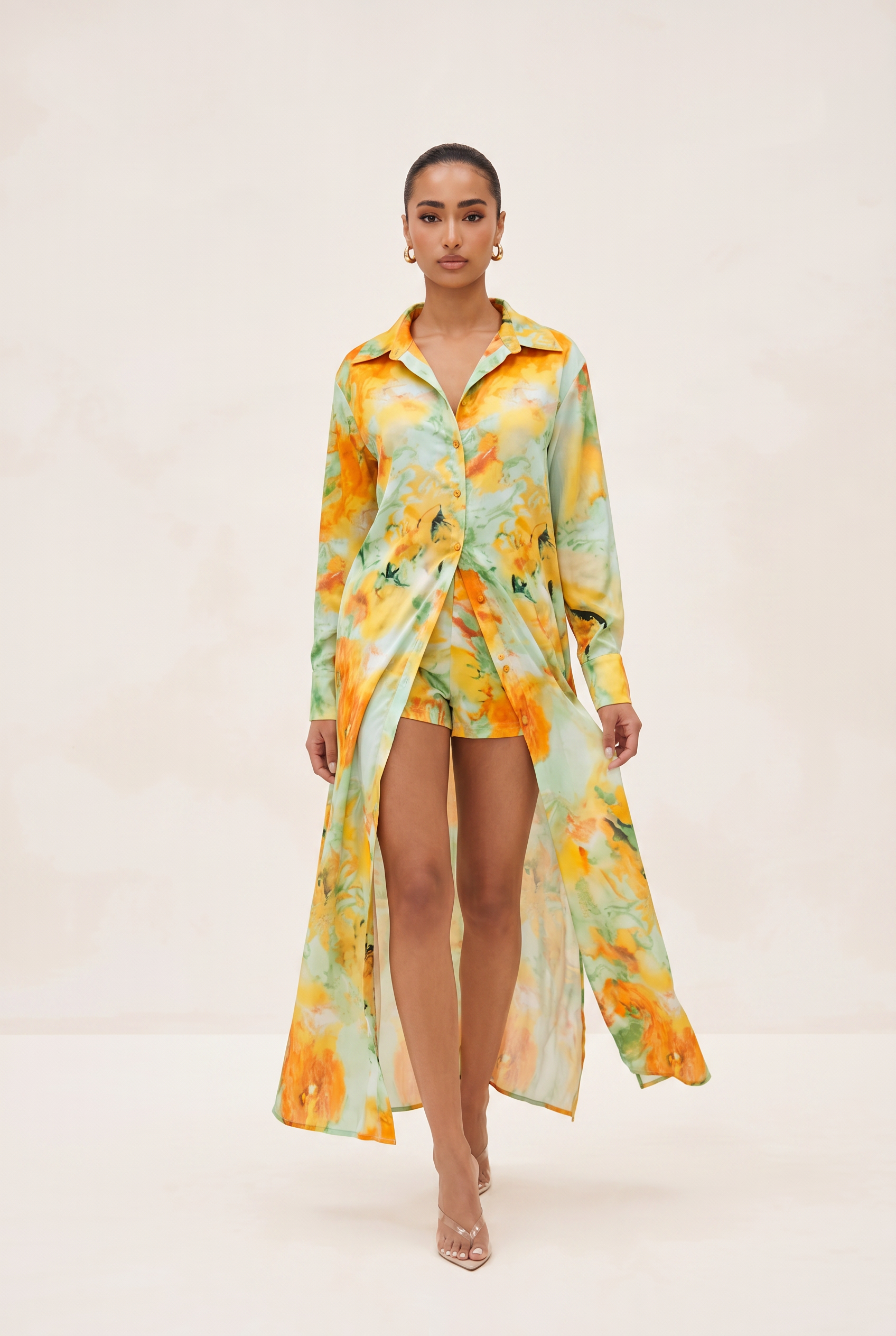 Woman wearing a floral dress with a white background