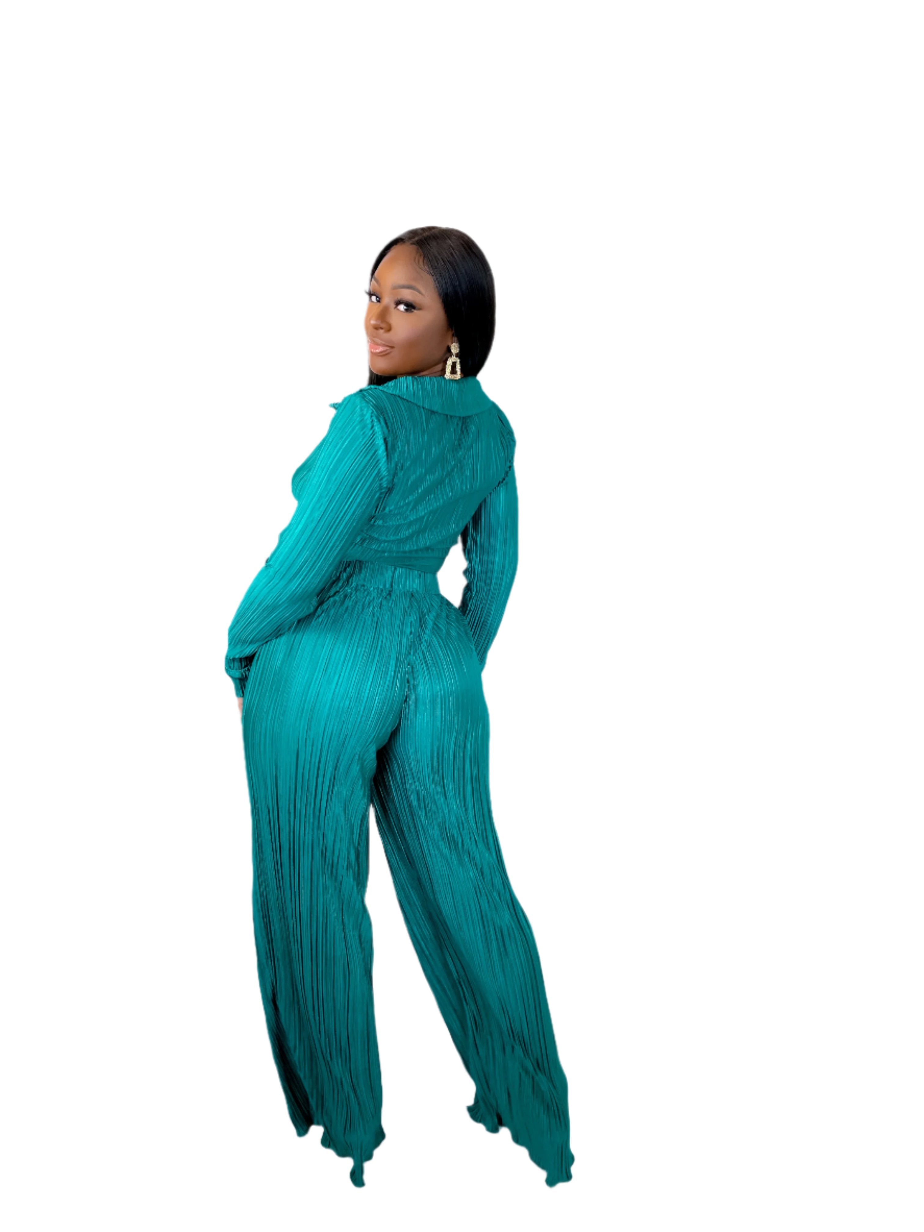 You will be the center of attention in this beautiful casual Living Over The Top Pants Set (Green). The pleated front tie crop top and high-waisted pants set are perfect for dinner, a girl's night out, or a special occasion and is guaranteed to get you noticed. Coming in a shiny emerald green color, it features a straight hem, long sleeves, and an elastic band on the waist giving you a refined look no matter where you may be.