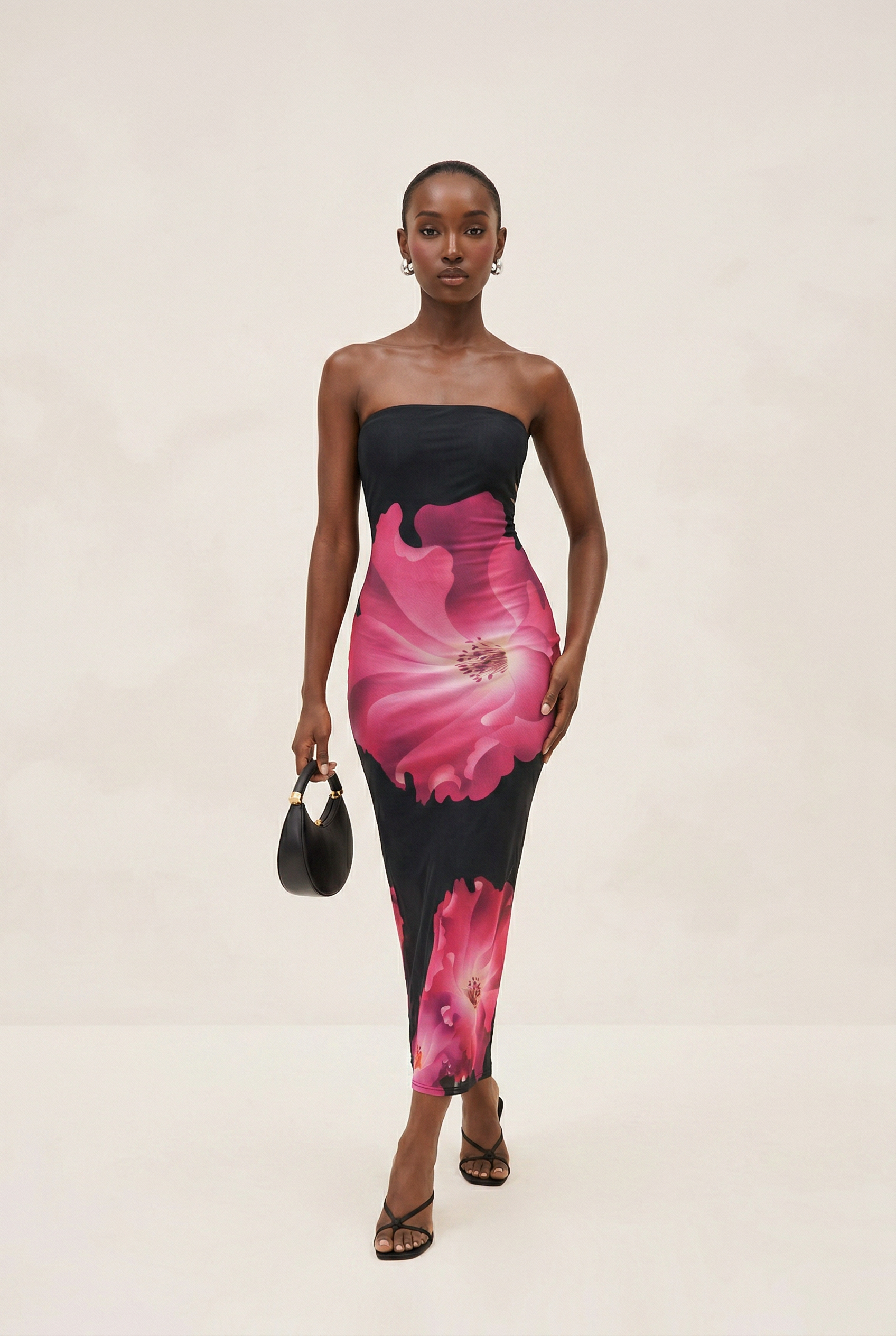 Woman wearing a strapless dress with pink floral pattern on a beige background