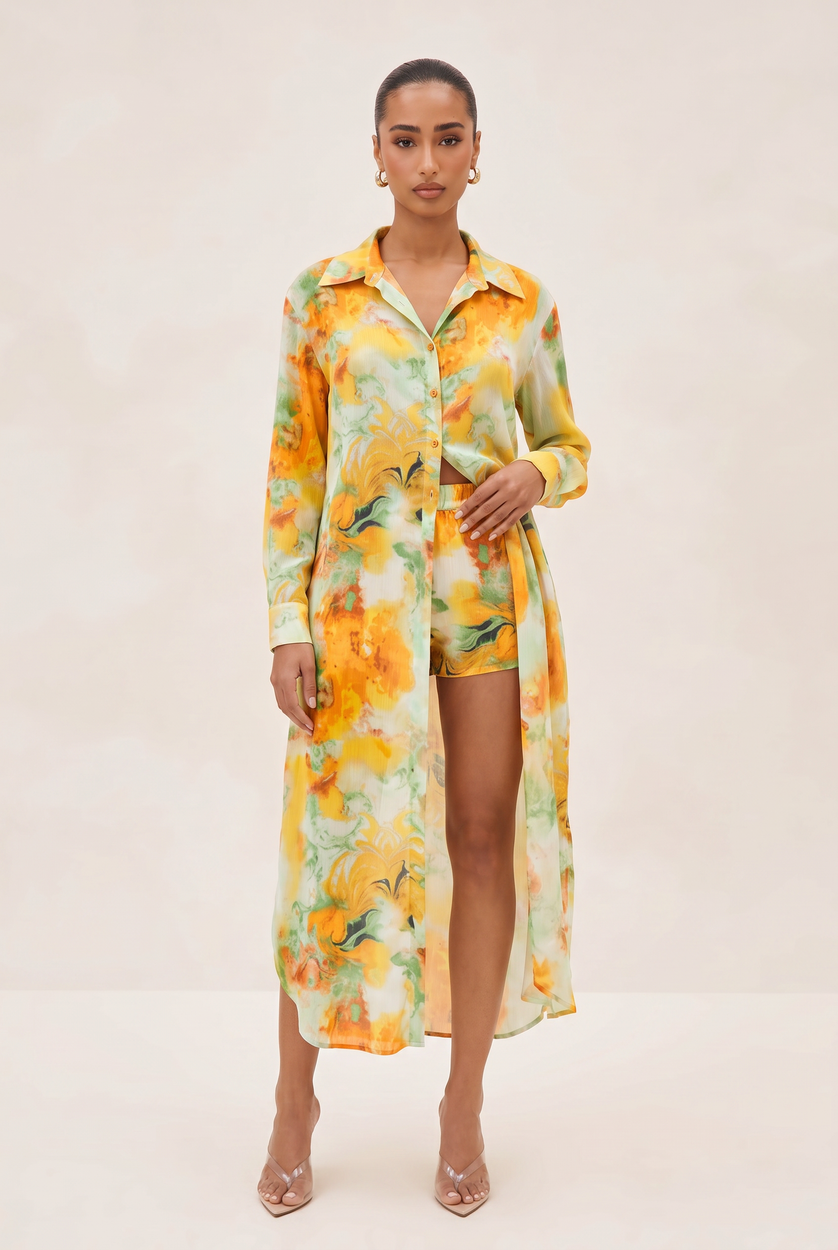 Woman wearing a floral dress with a plain background